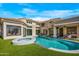 Luxury backyard featuring a freeform pool, spa, and expansive patio at 7439 E Beryl Ave, Scottsdale, AZ 85258