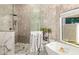 Large walk-in shower with marble and tile at 7439 E Beryl Ave, Scottsdale, AZ 85258