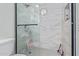 Clean shower with updated tile and glass enclosure at 7510 E Thomas Rd # 234, Scottsdale, AZ 85251