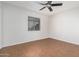 Bedroom with wood-look flooring and ceiling fan at 753 W Pampa Ave, Mesa, AZ 85210