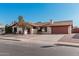 House with red roof, driveway, and landscaping at 753 W Pampa Ave, Mesa, AZ 85210