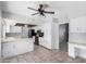 Kitchen with white cabinets, tile floors, and breakfast bar at 753 W Pampa Ave, Mesa, AZ 85210