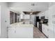 L-shaped kitchen with white cabinets and stainless steel appliances at 753 W Pampa Ave, Mesa, AZ 85210