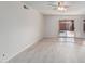 Living room features wood-look floors and sliding door to backyard at 753 W Pampa Ave, Mesa, AZ 85210