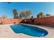 Relaxing kidney-shaped pool with brick surround at 753 W Pampa Ave, Mesa, AZ 85210