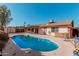 Inviting kidney-shaped pool in backyard at 753 W Pampa Ave, Mesa, AZ 85210