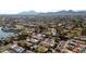 Aerial view of home near mountains and lake at 7605 E Via De Lindo --, Scottsdale, AZ 85258