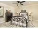 Charming bedroom with metal bed frame and dark dresser at 7605 E Via De Lindo --, Scottsdale, AZ 85258