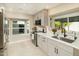 Modern kitchen with gray cabinets, white countertops, and stainless steel appliances at 7605 E Via De Lindo --, Scottsdale, AZ 85258