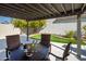 Covered patio with dining table and putting green at 7605 E Via De Lindo --, Scottsdale, AZ 85258