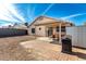 A backyard with a private outdoor space, complemented by a convenient storage shed and grill at 8553 N 112Th Ave, Peoria, AZ 85345