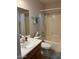 Clean bathroom with a bathtub, shower, and wooden vanity at 8553 N 112Th Ave, Peoria, AZ 85345