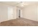 Cozy bedroom with a ceiling fan and neutral carpet at 8553 N 112Th Ave, Peoria, AZ 85345