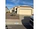 One-story house with a two-car garage and desert landscaping at 8553 N 112Th Ave, Peoria, AZ 85345