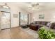 Inviting living room featuring a plush gray sectional sofa and neutral decor at 8553 N 112Th Ave, Peoria, AZ 85345