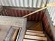 Unfinished basement area with exposed framing and a partial staircase at 9428 N 9Th Ave, Phoenix, AZ 85021