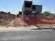 Under construction container home behind a chain link fence at 9428 N 9Th Ave, Phoenix, AZ 85021