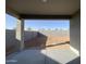 Covered back patio with view of block wall enclosed yard at 9526 W Luxton Ln, Tolleson, AZ 85353