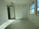 Bright bedroom with double door closet and large windows at 9526 W Luxton Ln, Tolleson, AZ 85353