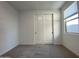 Carpeted bedroom with window and closet, offering a bright space at 9526 W Luxton Ln, Tolleson, AZ 85353