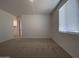 Bedroom with carpet, a window with blinds and door to walk in closet at 9526 W Luxton Ln, Tolleson, AZ 85353