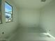 Spacious bedroom with large windows and ample natural light at 9526 W Luxton Ln, Tolleson, AZ 85353