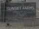 Community entrance sign for Sunset Farms at 9526 W Luxton Ln, Tolleson, AZ 85353