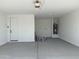 Spacious two-car garage with a door to the house at 9526 W Luxton Ln, Tolleson, AZ 85353