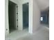 Interior hallway with access to bedrooms and bathroom at 9526 W Luxton Ln, Tolleson, AZ 85353