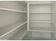 Bright, spacious pantry with ample shelving for storage at 9526 W Luxton Ln, Tolleson, AZ 85353