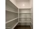 Walk-in pantry with ample shelving at 9526 W Luxton Ln, Tolleson, AZ 85353