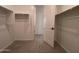 Spacious walk-in closet with ample shelving and rod space at 9526 W Luxton Ln, Tolleson, AZ 85353