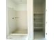 Bathroom with shower and built-in shelving at 9530 W Luxton Ln, Tolleson, AZ 85353