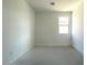 Empty bedroom with a window and neutral walls at 9530 W Luxton Ln, Tolleson, AZ 85353