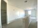 Large bonus room with a built-in half wall and closet at 9530 W Luxton Ln, Tolleson, AZ 85353