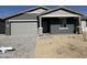 Charming single-story home with a two-car garage and attractive gray color scheme at 9530 W Luxton Ln, Tolleson, AZ 85353