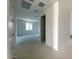 Bright hallway leading to other rooms with a window at 9530 W Luxton Ln, Tolleson, AZ 85353