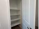 Pantry featuring white shelves that offer storage for food and kitchen essentials at 9530 W Luxton Ln, Tolleson, AZ 85353