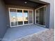 Covered patio featuring sliding glass doors that seamlessly blend indoor/outdoor living spaces at 9530 W Luxton Ln, Tolleson, AZ 85353