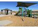 Modern playground equipment under a shaded area at 9530 W Luxton Ln, Tolleson, AZ 85353