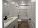 Clean bathroom featuring a shower-tub combo with a sleek vanity and modern fixtures at 9534 W Luxton Ln, Tolleson, AZ 85353