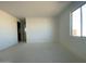 Spacious bedroom with access to a bathroom at 9534 W Luxton Ln, Tolleson, AZ 85353