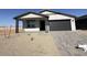 Charming single-story home featuring a manicured front yard and attached two-car garage at 9534 W Luxton Ln, Tolleson, AZ 85353