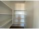 Bright and spacious pantry with ample shelving at 9534 W Luxton Ln, Tolleson, AZ 85353