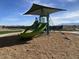 Modern playground with shade structure and climbing equipment at 9534 W Luxton Ln, Tolleson, AZ 85353