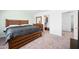 Main bedroom with wood bed frame and walk-in closet at 961 W 20 Th St, Florence, AZ 85132