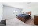 Main bedroom with wood bed frame and window at 961 W 20 Th St, Florence, AZ 85132