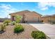 New construction home with a two-car garage and drought-tolerant landscaping at 961 W 20 Th St, Florence, AZ 85132