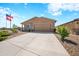 Single-story home with two-car garage and desert landscaping at 961 W 20 Th St, Florence, AZ 85132