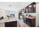 Modern kitchen features granite countertops, dark cabinetry, and stainless steel appliances at 961 W 20 Th St, Florence, AZ 85132